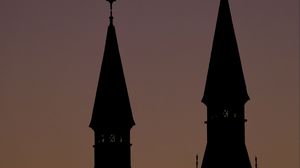 Превью обои башни, силуэты, вечер, закат, темный