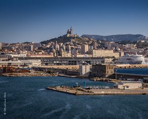 Превью обои башня, гора, здания, город, море, пристань