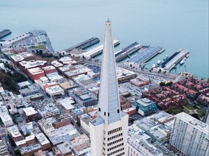 Превью обои башня, небоскребы, здания, пристань, море