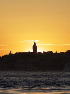 Превью обои башня, здания, силуэты, море, закат