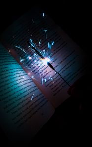 Превью обои бенгальский огонь, искры, книга, текст