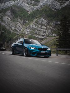 Превью обои bmw, автомобиль, вид сбоку, дорога, скала