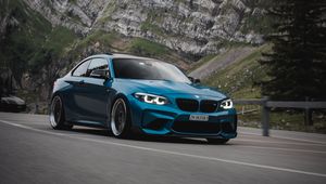 Превью обои bmw, автомобиль, вид сбоку, дорога, скала