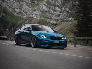 Превью обои bmw, автомобиль, вид сбоку, дорога, скала