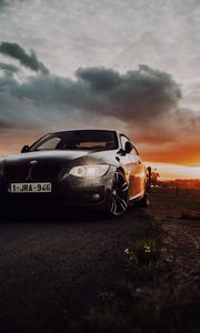 Превью обои bmw, автомобиль, вид спереди, фары, свечение, черный