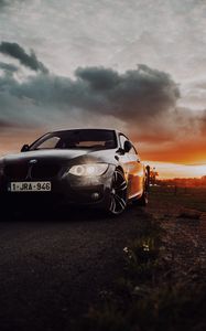 Превью обои bmw, автомобиль, вид спереди, фары, свечение, черный