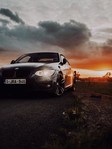 Превью обои bmw, автомобиль, вид спереди, фары, свечение, черный