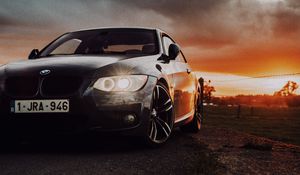 Превью обои bmw, автомобиль, вид спереди, фары, свечение, черный