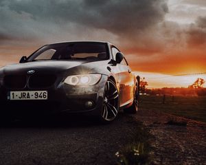 Превью обои bmw, автомобиль, вид спереди, фары, свечение, черный