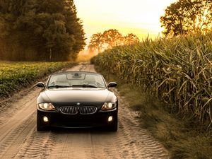 Превью обои bmw, машина, вид спереди, фара, дорога