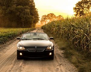 Превью обои bmw, машина, вид спереди, фара, дорога
