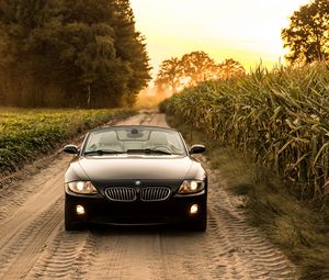 Превью обои bmw, машина, вид спереди, фара, дорога