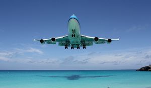 Превью обои boeing 747, тень, океан, полет