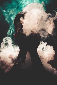 Превью обои человек, дым, руки, разноцветный дым