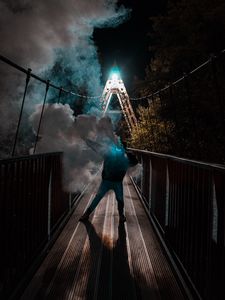 Превью обои человек, маска, неон, дым, мост