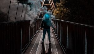 Превью обои человек, маска, неон, дым, мост, аноним