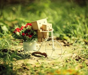 Превью обои danboard, велосипед, картонные роботы, цветы, трава