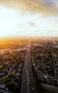 Превью обои дорога, автомобили, дома, деревья, вид сверху