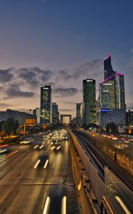 Превью обои дорога, автомобили, здания, вечер, огни