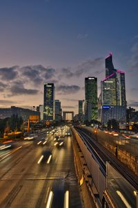 Превью обои дорога, автомобили, здания, вечер, огни