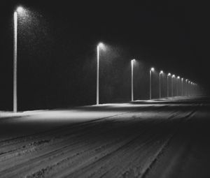 Превью обои дорога, фонари, ночь, снег, темный