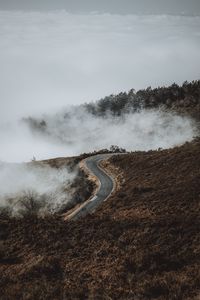 Превью обои дорога, холм, облака, вид сверху