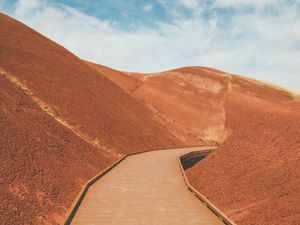 Превью обои дорога, холмы, даль, небо