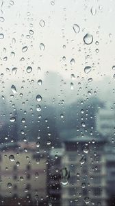 Превью обои дождь, окно, стекло, здания, капли