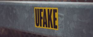 Превью обои fake, наклейка, надпись, забор, сетка