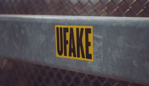 Превью обои fake, наклейка, надпись, забор, сетка
