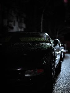 Превью обои фара, автомобиль, дождь, темнота, вид спереди