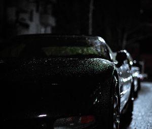 Превью обои фара, автомобиль, дождь, темнота, вид спереди