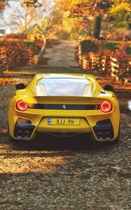 Превью обои ferrari, спорткар, желтый, вид сзади
