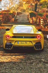 Превью обои ferrari, спорткар, желтый, вид сзади