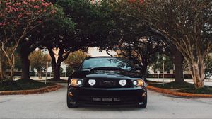 Превью обои ford mustang, спорткар, вид спереди, черный, деревья