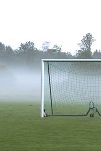 Превью обои футбольные ворота, поле, футбол, туман, деревья, мгла