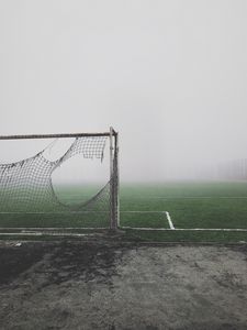 Превью обои футбольные ворота, рваный, туман, газон, настроение, мрачный