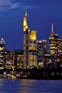 Превью обои германия, франкфурт-на-майне, вечер, мегаполис, небоскребы, подсветка, мост, река