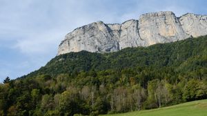 Превью обои гора, скала, деревья, лужайка, склон