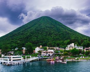 Превью обои гора, вершина, море, здания, пирс