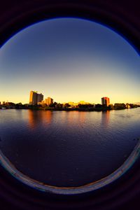 Превью обои город, здания, вода, иллюминатор, вид