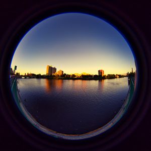 Превью обои город, здания, вода, иллюминатор, вид