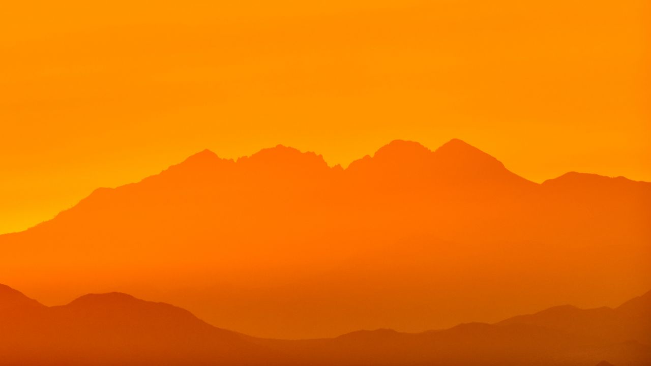Обои горы, силуэт, скалы, оранжевый
