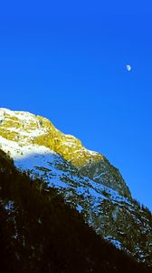 Превью обои горы, скалы, луна, деревья, заснеженный