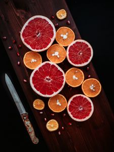 Превью обои грейпфрут, апельсин, гранат, фрукты, дольки