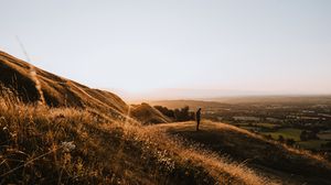 Превью обои холмы, человек, силуэт, закат, пейзаж