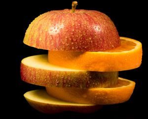 Превью обои яблоко, апельсин, дольки, капли, фрукты, еда