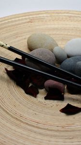 Превью обои япония, палочки, лепестки, камни, гармония