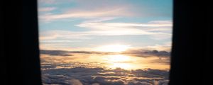 Превью обои иллюминатор, облака, закат, черный