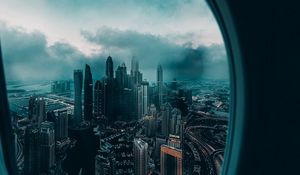 Превью обои иллюминатор, окно, город, вид сверху